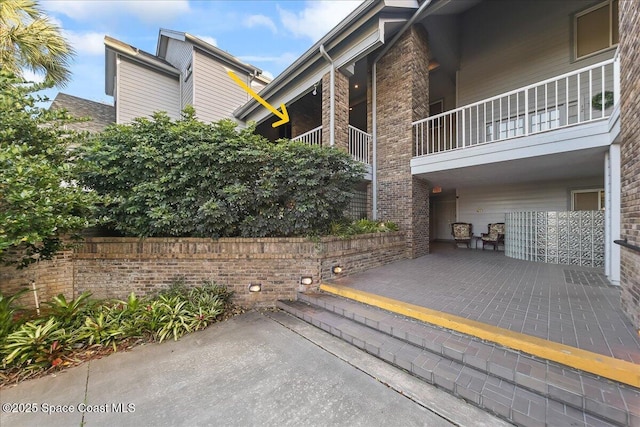 exterior space with brick siding