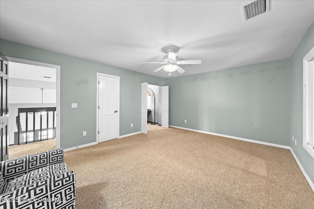 carpeted bedroom with visible vents, ceiling fan, and baseboards