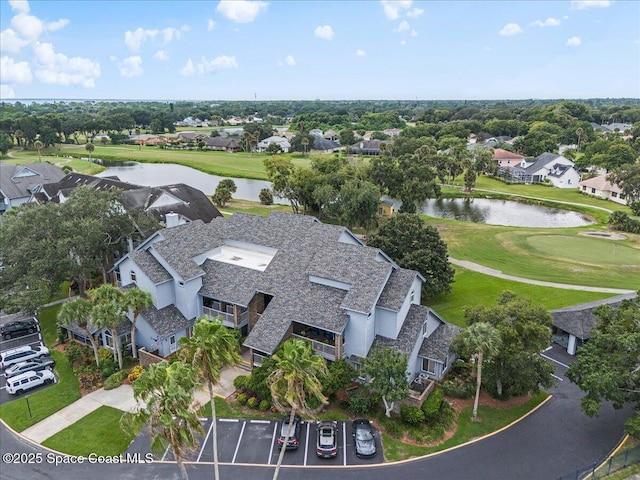 birds eye view of property featuring a water view and a residential view