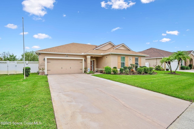 ranch-style home featuring a garage and a front lawn