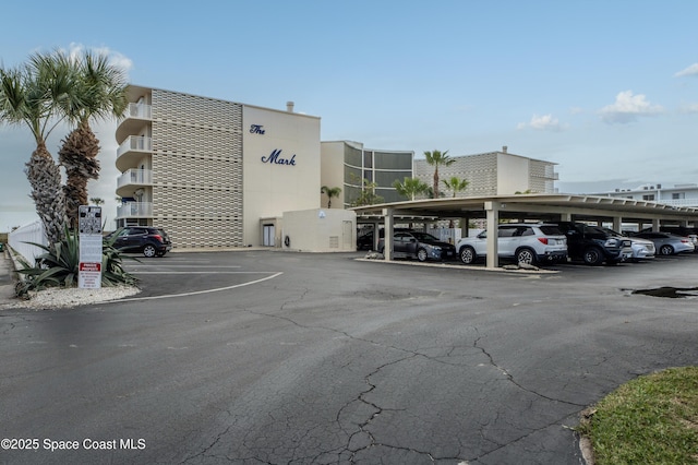 view of partially covered parking lot