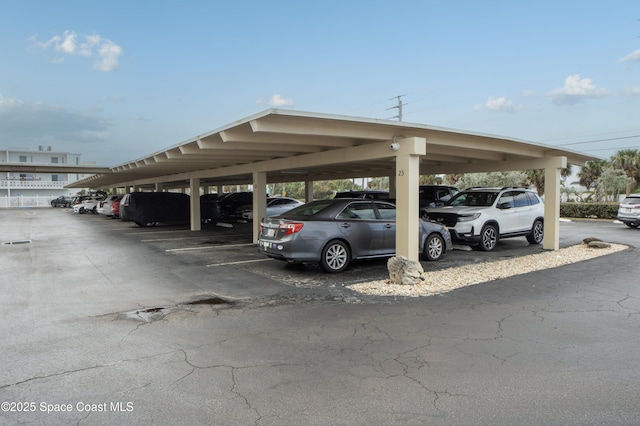 view of partially covered parking lot