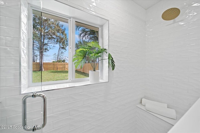 bathroom with a tile shower