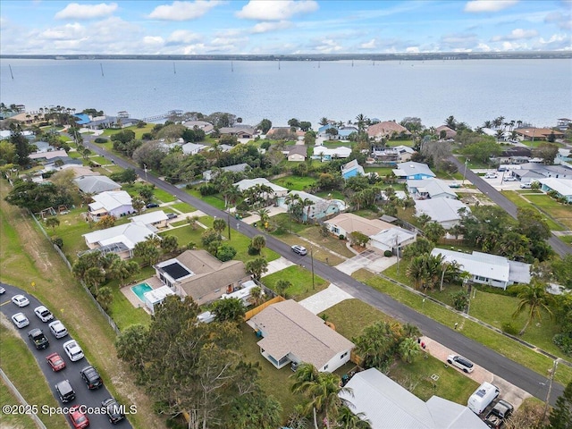 birds eye view of property featuring a residential view and a water view