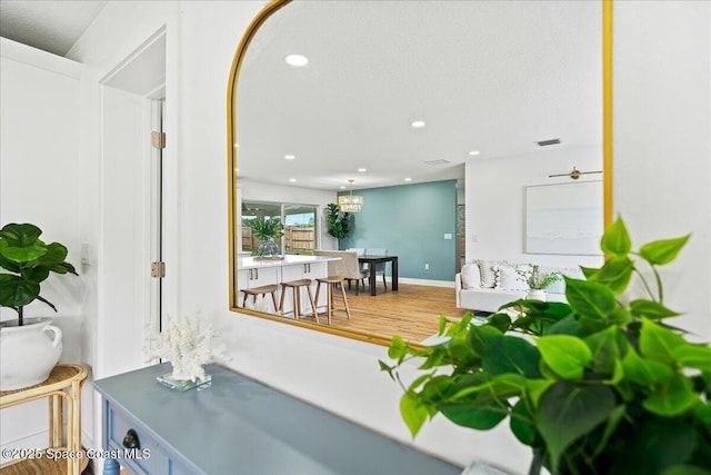 interior space featuring recessed lighting, visible vents, and wood finished floors