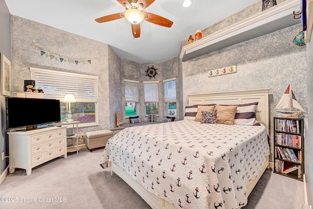 bedroom featuring ceiling fan and light colored carpet