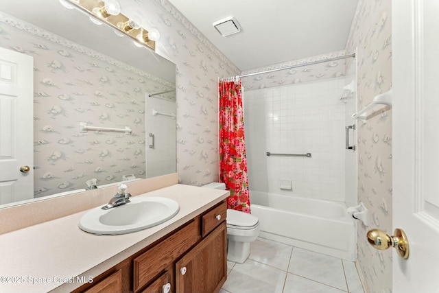 full bathroom featuring tile patterned floors, shower / bath combo with shower curtain, vanity, and toilet