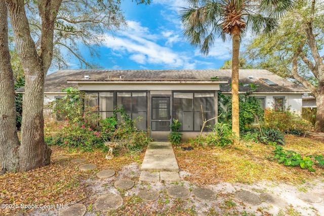 single story home with a sunroom