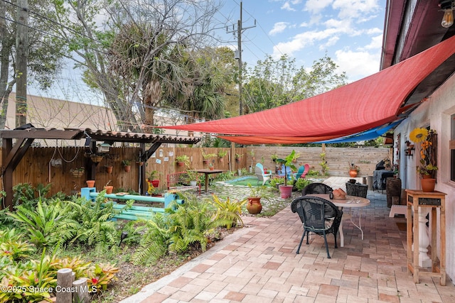 view of patio / terrace with outdoor dining space and a fenced backyard