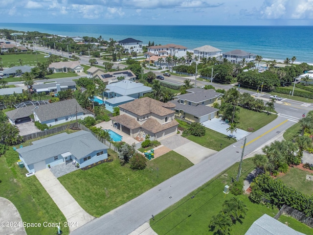 birds eye view of property with a water view and a residential view