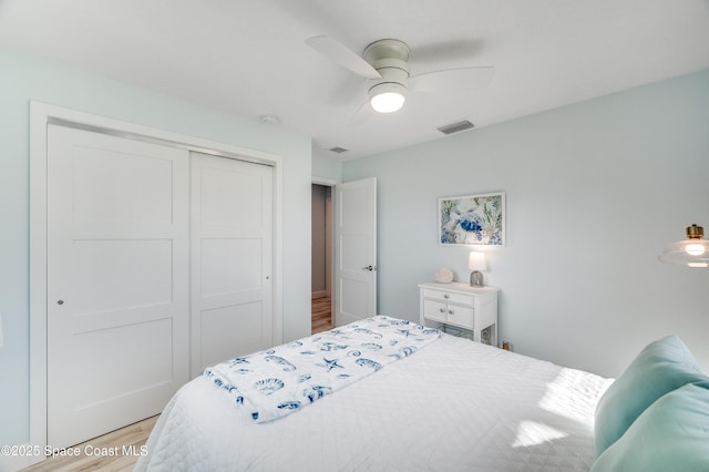 122 Poinsetta St, Indialantic, FL 32903 - bedroom with wood finished floors, a closet, and ceiling fan