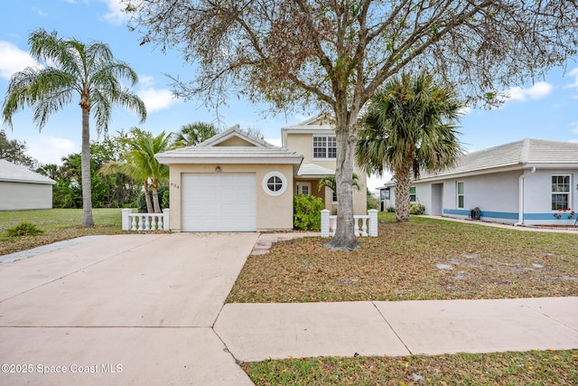 view of front facade with a front yard and a garage