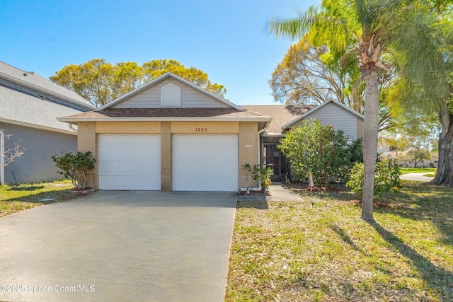 view of front facade with a front lawn and a garage