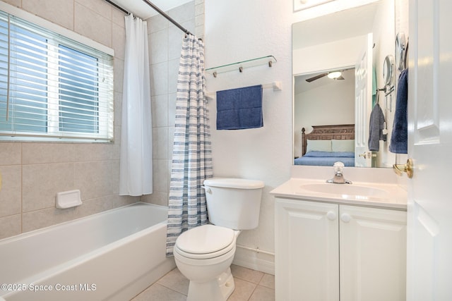 ensuite bathroom with toilet, ensuite bathroom, shower / bath combo, vanity, and tile patterned flooring