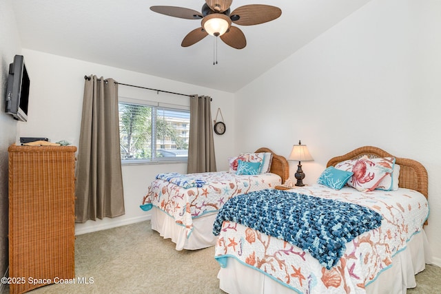 bedroom featuring lofted ceiling, carpet flooring, a ceiling fan, and baseboards