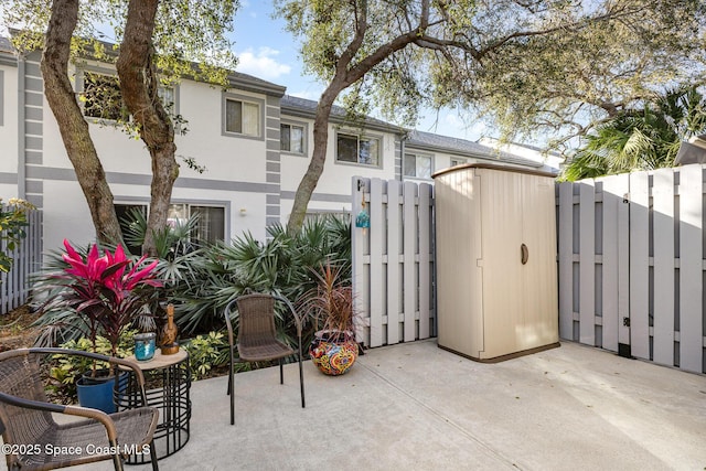 exterior space with fence and a patio