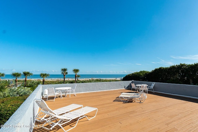 wooden deck with a water view