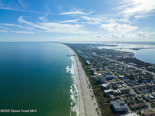 drone / aerial view featuring a view of the beach and a water view