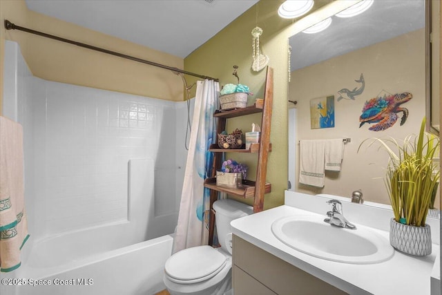 bathroom with shower / tub combo, vanity, and toilet