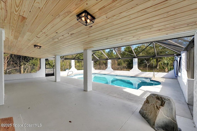 view of pool with a lanai and a patio area