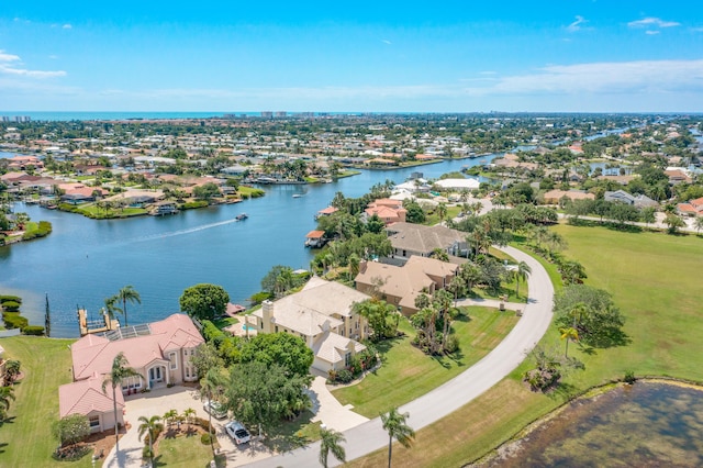 birds eye view of property featuring a residential view and a water view