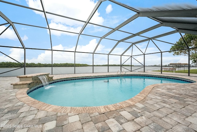 pool with a patio area and glass enclosure