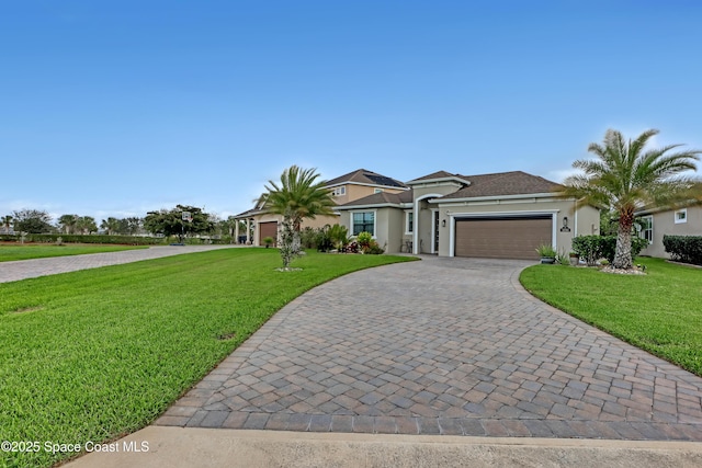 single story home with a front yard and a garage