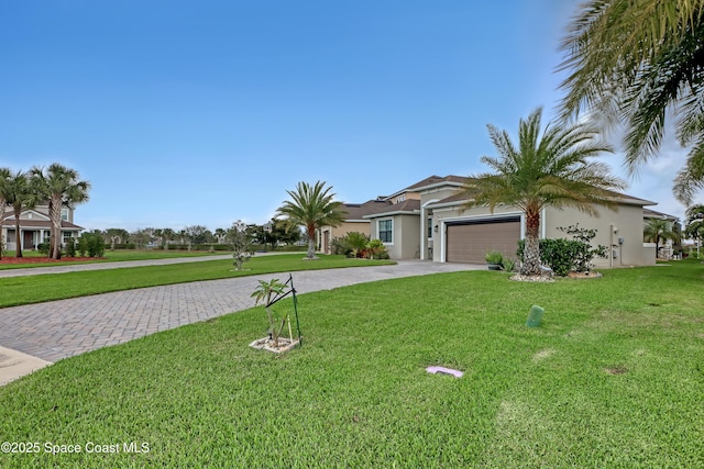 single story home with a front yard and a garage