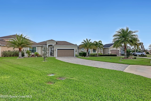 ranch-style home featuring a front lawn and a garage