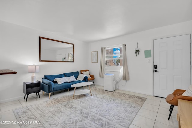 living room with light tile patterned floors and baseboards
