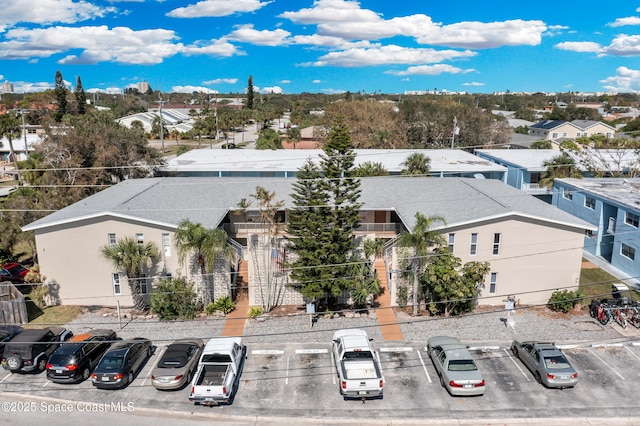 birds eye view of property with a residential view