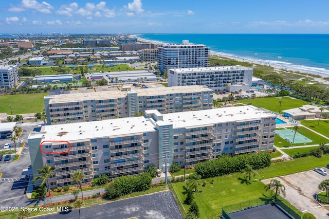 bird's eye view featuring a view of city, a water view, and a view of the beach