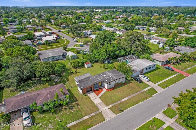 birds eye view of property with a residential view