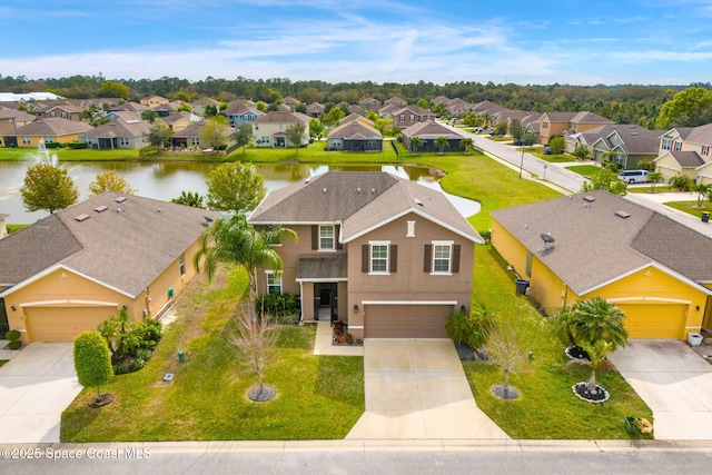 bird's eye view with a water view and a residential view