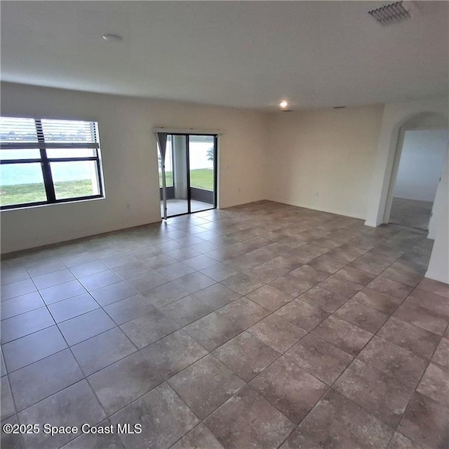 tiled empty room with visible vents