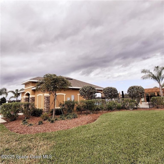 view of side of property with a yard and stucco siding