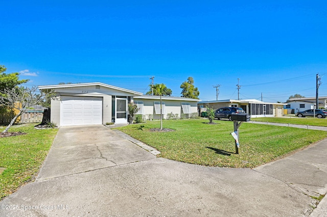 ranch-style home with an attached garage, driveway, a front lawn, and fence