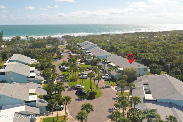 aerial view with a water view, a residential view, and a view of the beach