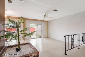 interior space with a ceiling fan and visible vents