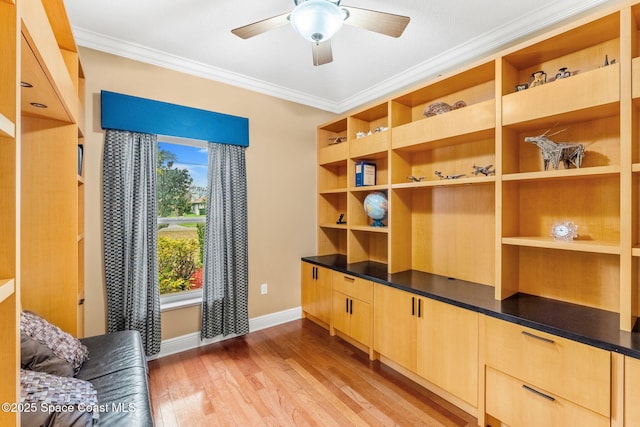 sitting room with ornamental molding, baseboards, ceiling fan, and light wood finished floors