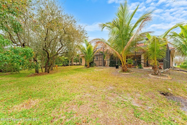 view of yard featuring a lanai