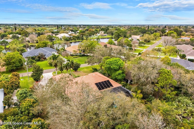 drone / aerial view featuring a water view and a residential view