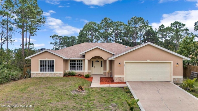 single story home with an attached garage, stone siding, driveway, and stucco siding