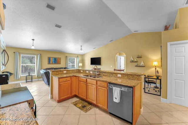 kitchen with open floor plan, a sink, stainless steel dishwasher, and light tile patterned floors