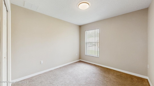 1749 Christina Lee Ln, Saint Cloud, FL 34769 - carpeted spare room featuring a textured ceiling and baseboards