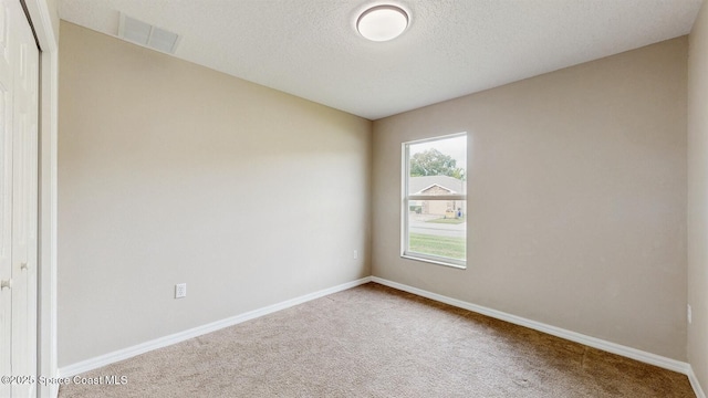 1749 Christina Lee Ln, Saint Cloud, FL 34769 - carpeted empty room with visible vents, a textured ceiling, and baseboards