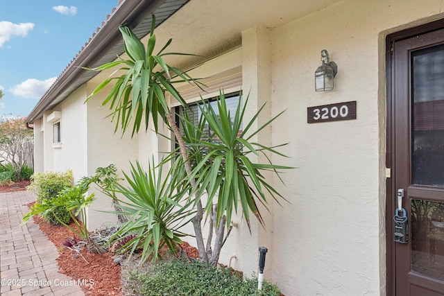 view of side of home featuring stucco siding