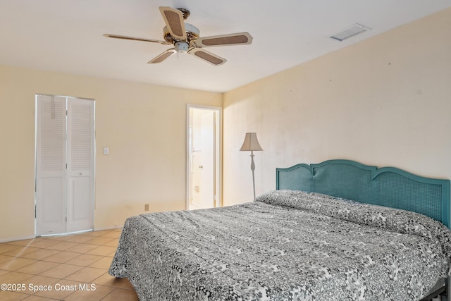 bedroom with light tile patterned floors, baseboards, visible vents, and ceiling fan