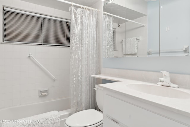 bathroom featuring vanity, toilet, and shower / bath combo with shower curtain