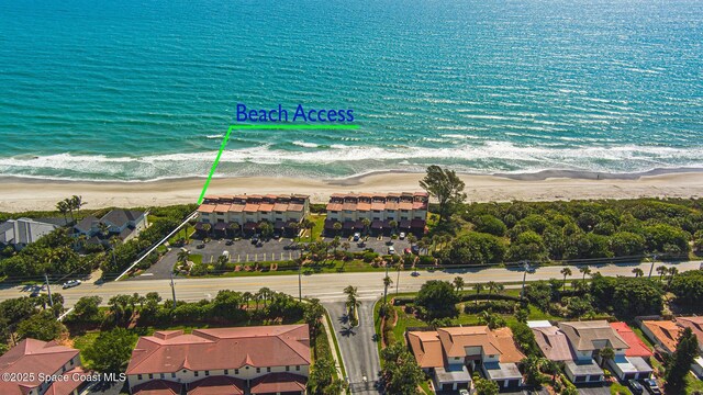 aerial view featuring a residential view, a water view, and a beach view